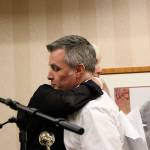 Jerry Blackburn hugs Jody Mull of the Issaquah Schools Foundation as he receives the foundation&rsquo;s Golden Apple Award. Nicole Jennings/staff photo