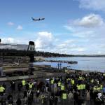 Employees at Boeing Renton watch as the 737 MAX 9 takes to the skies above Lake Washington for its first flight.