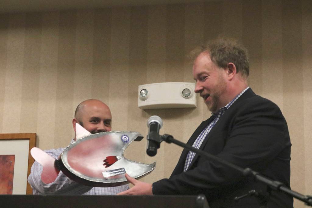 Martin Buckley, right, is swimmingly presented with the chamber&rsquo;s Salmon Days Volunteer of the Year Award by Brian Twiggs, the chamber&rsquo;s festivals director. Carrie Rodriguez/staff photo