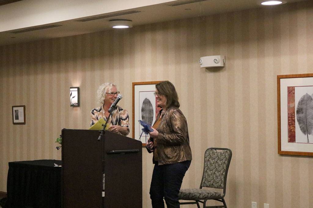 Judy Case, right, is presented with the Human and Spiritual Values Award from Sherrie Reed, left, of the Issaquah Kiwanis. Nicole Jennings/staff photo