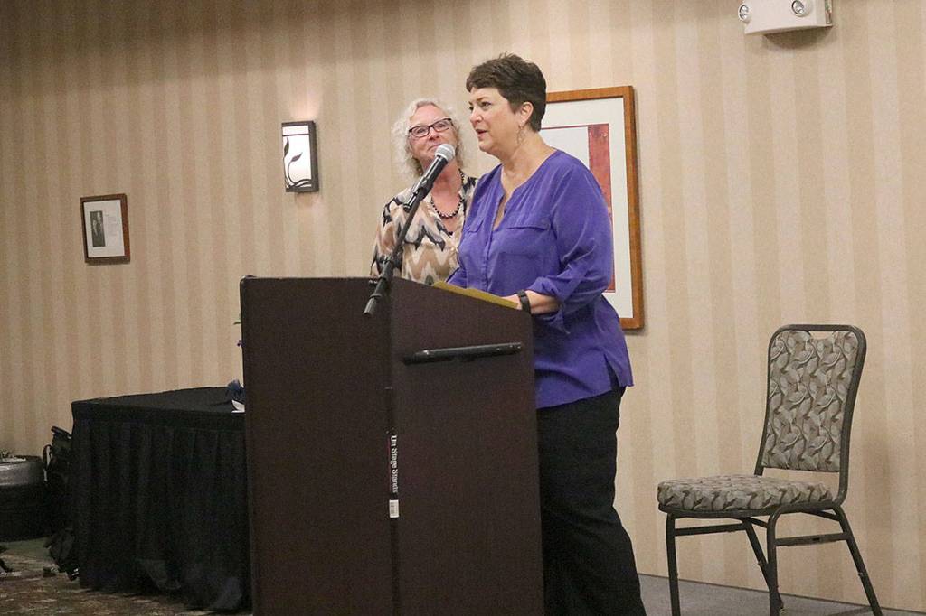 Issaquah Kiwanis Volunteer of the Year Award winner Debbie Berto gives a thank you to the Kiwanis after receiving her award. Nicole Jennings/staff photo