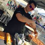 Brandon from Issaquah-based WiseGuy Italian Street Food dishes up his famous Italian hoagie. William Shaw/staff photo