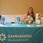 Katie Littlefield of Sammamish Smiles Dentistry shows off her pearly whites. The new dental office just opened up on Southeast Fourth Street near Metropolitan Market. Nicole Jennings/staff photo