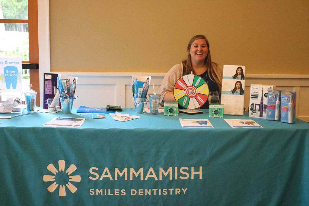 Katie Littlefield of Sammamish Smiles Dentistry shows off her pearly whites. The new dental office just opened up on Southeast Fourth Street near Metropolitan Market. Nicole Jennings/staff photo