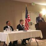 At the podium, Chamber Board President David Bleiwiess introduces the three candidates. Nicole Jennings/staff photo