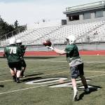 Shaun Scott, staff photo                                Skyline Spartans running back Carson Clark, right, hauls in a pass in the flat during a spring football practice session on June 6 at Skyline High School in Sammamish.