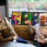 Clark fourth grader Elias Saarela points to the picture he created while his mom Mira looks on. Nicole Jennings/staff photo