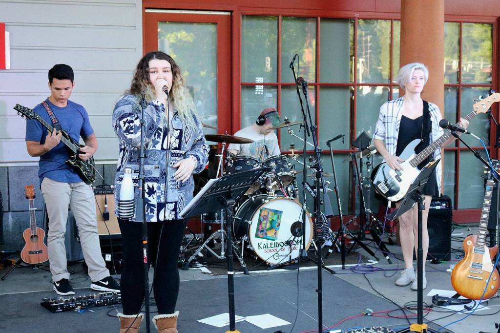 Students from Kaleidoscope School of Music in Issaquah rocked out in front of the library. Nicole Jennings/staff photo