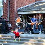 Issaquah rock n&rsquo; roll band The Tasty Waves brought classic hits of the &rsquo;70s, such as Steely Dan&rsquo;s &ldquo;Old School&rdquo; to the steps of City Hall as youngsters joined in with their dance moves. Nicole Jennings/staff photo