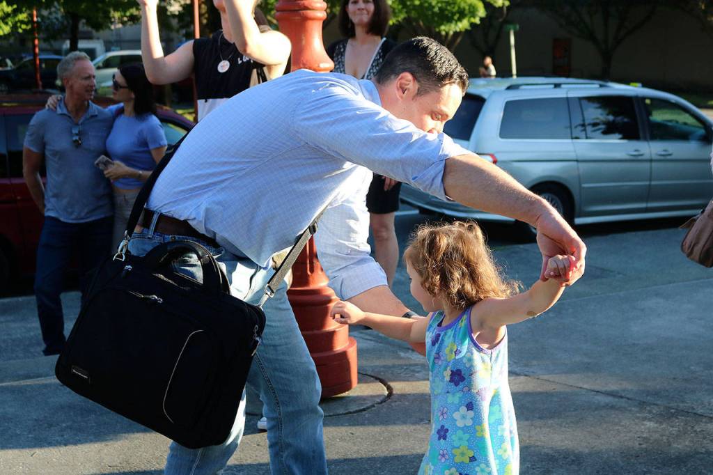 Fathers and daughters danced along to the rock music outside of City Hall. Make Music Day is not just a time for the musicians onstage to perform; audience members are encouraged to dance and clap along. Nicole Jennings/staff photo
