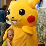 Liam Brown, 3, hugs his new friend Pikachu at the summer reading party on June 22 at the Issaquah Library. Nicole Jennings/staff photo