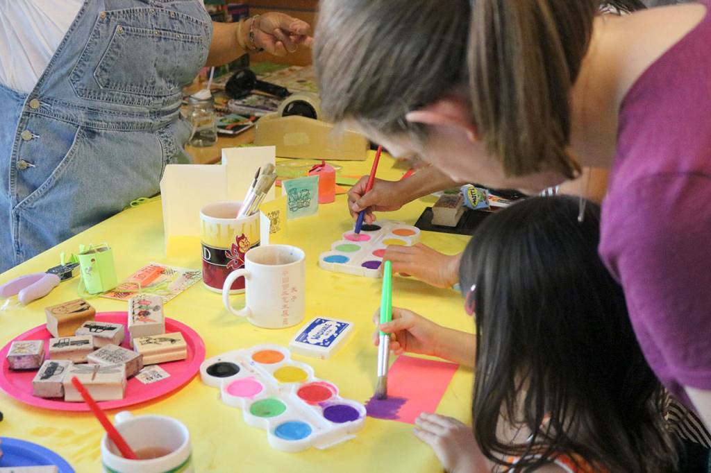 Kids also got to try their hand at painting postcards. Nicole Jennings/staff photo