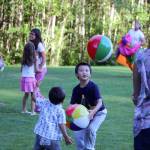 Brothers Yan, 5, and Derek Xu, 2, play with bouncy balls at the Sammamish Concerts in the Park July 13. Megan Campbell/staff photo