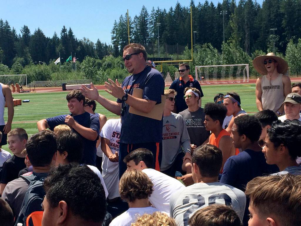 Shaun Scott, staff photo                                Eastside Catholic Crusaders head football coach Jeremy Thielbahr introduces one of the team&rsquo;s assistant coaches during the first day of the annual Eastside Catholic youth football camp on July 17 in Sammamish.