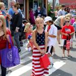 Kids lined up along the parade route to catch Tootsie Rolls and Snickers. Nicole Jennings/staff photo