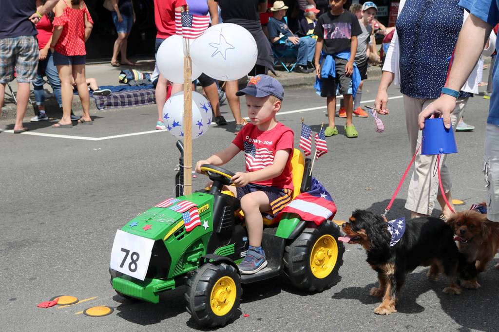 Fewer combinations say America quite as well as a John Deere tractor and the Star-Spangled Banner. Nicole Jennings/staff photo