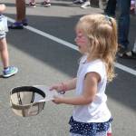 Kids used baseball caps and bags to collect the multitude of candy thrown by parade participants. Nicole Jennings/staff photo