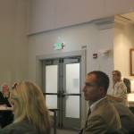 Eirlys Vanderhoff, president of the Sammamish Heritage Society, explains the historic value of Baker House. Just in front of her and to her left, Dan Zimberoff, attorney for the Laurels Homeowners Association, observes the presentation. Nicole Jennings/staff photo