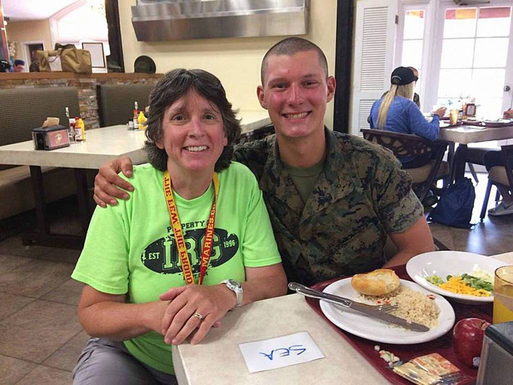 In a heartfelt moment, Issaquah High School math teacher Kathleen Myers was reunited with her former student, Derek Fletcher, who will soon complete his recruit training and become a Marine. Photo courtesy of Kathleen Myers