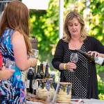 Attendees sample delicious reds from William Church Winery in Woodinville.