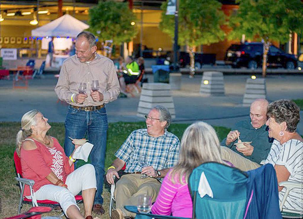 Sammamish Mayor Bob Keller (wearing plaid shirt) takes a break from work and enjoys himself at the Sammamish Nights portion of the event.