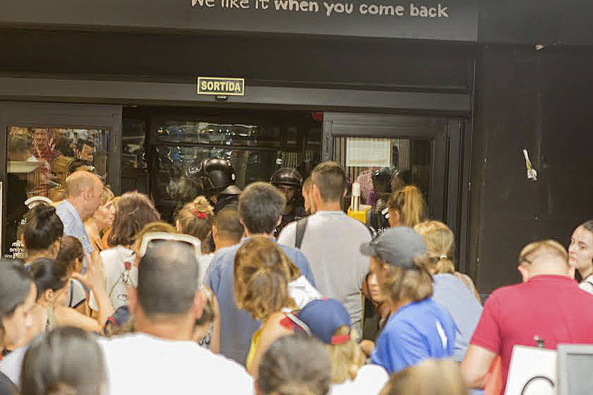 People leave the Carrefour grocery store after staying put for five hours. Photo courtesy of Kronstad family