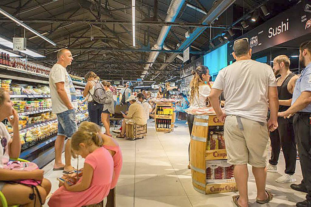 About 100 people hide in Carrefour for five hours, sitting on overturned crates. Photo courtesy of Kronstad family