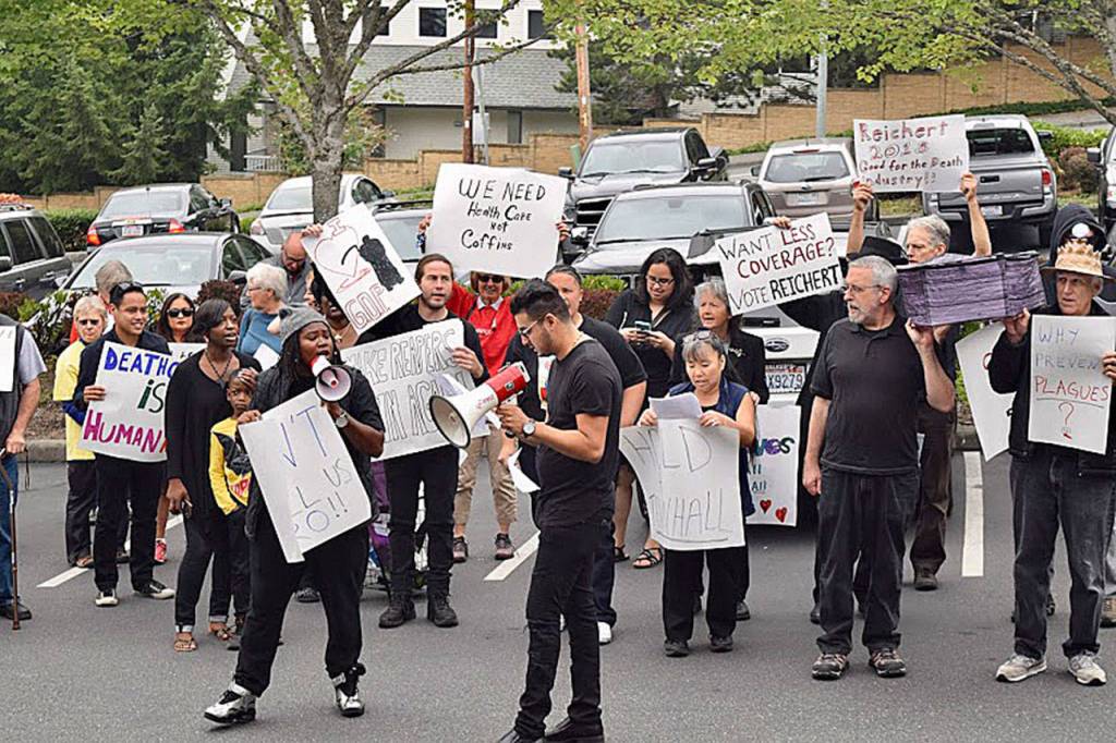 The &ldquo;mourners&rdquo; dressed in black to draw attention to what they see as the lives that will be lost if health care funding is cut. Photo courtesy of Ellen Ferencek/Main Street Alliance