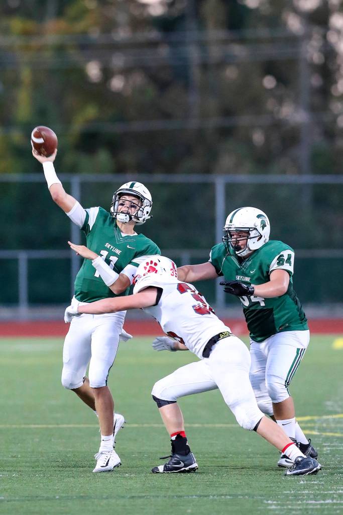 Photo courtesy of Rick Edelman/Rick Edelman Photography                                Skyline Spartans quarterback Joe Green just got rid of the football before being hit by a Mount Si Wildcats defensive player. The Wildcats defeated the Spartans 41-30 in the season opener for both teams on Sept. 1. Skyline (0-1) will host the Newport Knights in a KingCo 4A matchup at 7 p.m. on Sept. 8 at Skyline High School in Sammamish.