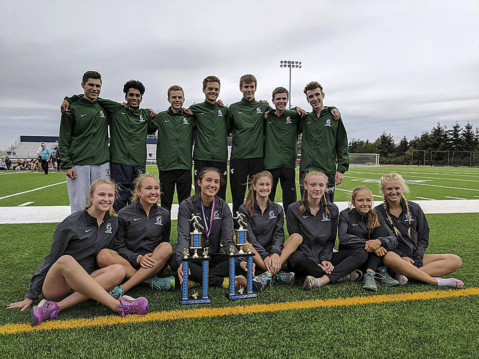 Photo courtesy of Susan Schlepp                                The Skyline Spartans boys and girls Cross Country teams put together dominating performances at the 19th annual Bellarmine Prep Cross Country Invitational on Sept. 9 in Tacoma. The Skyline boys squad captured first place, compiling 108 team points (low score wins in Cross Country). Gonzaga Prep finished in second place with 122 team points. The Spartans girls team finished in first place, tallying 86 team points. Holy Names captured second place with 130 total points. On the boys side, Griffin Ganz finished in eighth place with a time of 10:18.4 on the two-mile course. Alexander Alamangos captured 13th place as well. In girls action, senior Geneva Schlepp captured first place with a time of 11:58.2. Mia Crocker earned 16th place and senior Amber McGraw finished in 17th place individually.
