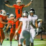 Photo courtesy of Rick Edelman/Rick Edelman Photography                                The Eastside Catholic Crusaders cruised to a 35-0 victory against the Union Titans in a non-league contest between powerhouse football programs on Sept. 15 in Sammamish. The Crusaders improved their overall record to 3-0 with the win. Eastside Catholic Crusaders receiver David Pritchard (center) celebrates after scoring a touchdown against the Titans. Eastside Catholic will face the Rainier Beach Vikings at 7 p.m. on Sept. 22 in Seattle.