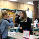 A student immigrant performs an eye test (conducted in Danish) at the medical examination area. This test would have been done to check for trachoma, a contagious eye disease from southern Europe. Nicole Jennings/staff photo