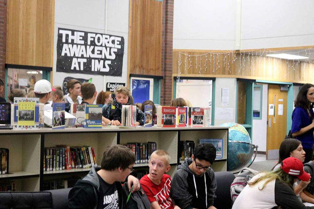 The third-class immigrants in quarantine (behind the books) are separated from the first- and second-class passengers who were allowed to go straight to the New York ferry without undergoing medical or legal questioning. Nicole Jennings/staff photo