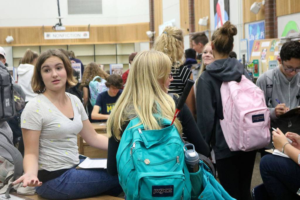 Immigrants sit in quarantine waiting for their next orders. Nicole Jennings/staff photo