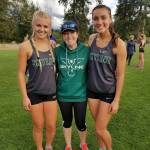 Photo courtesy of Susan Schlepp                                The Skyline Spartans girls Cross Country team captured a victory in a KingCo 4A double dual meet against Inglemoor and North Creek on Sept. 20 at North Creek High School in Bothell. The Spartans improved their KingCo dual meet record to 4-0 with the victory. Geneva Schlepp finished in first place on the 5K course (3.2 miles) with a time of 18 minutes, 32 seconds. Skyline junior Brooke Harmer captured second place with a time of 20:34. Amber McGraw earned a fourth place finish (20:45), freshman Lauren Holford collected a fifth place showing with a time of 20:53 and Mary Webb attained an eighth place finish. McGraw, Skyline girls coach Chelsea VanDeBrake and Schlepp are pictured in the above photo.