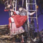 Little Red Riding Hood (Arika Matoba) meets a sweet-talking wolf (Kevin Vortmann) in the woods. Photo courtesy of Village Theatre