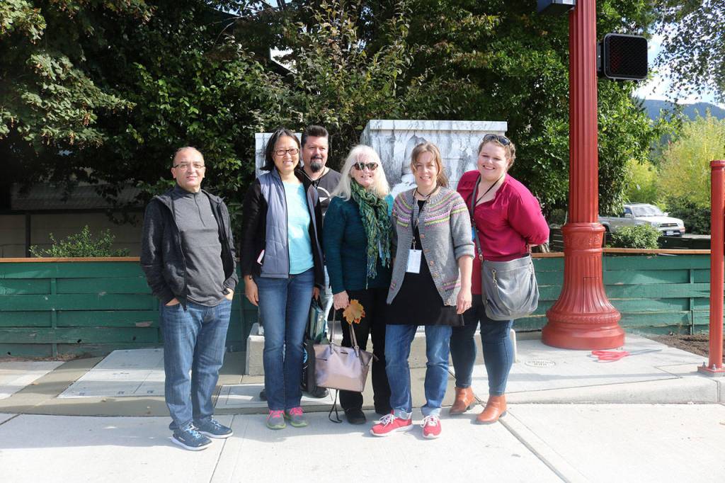 The Sister Cities Commission and their Norwegian guests smile in front of &ldquo;Journey.&rdquo; From left, Mohammed Belali, Oligia Zhang, Ivar Karvatn, Robin Kelley, Bergljot Hals, Heather Stapf. Nicole Jennings/staff photo
