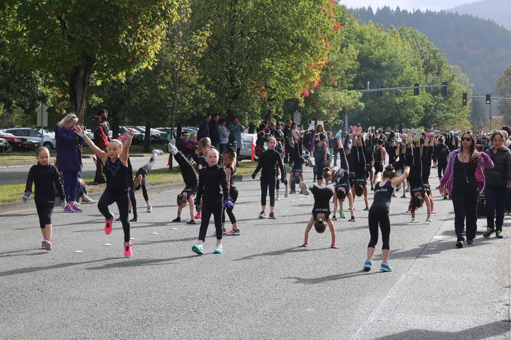Gymnasts of Gymnastics East perform cartwheels. Nicole Jennings/staff photo