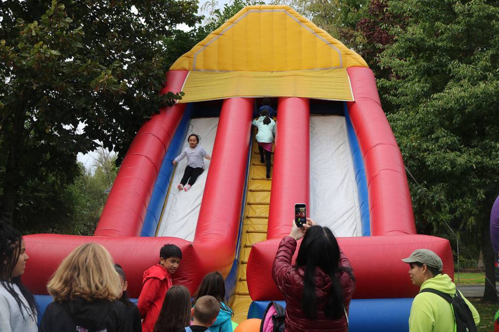 A child slides down the giant slide in the Field of Fun. Nicole Jennings/staff photo