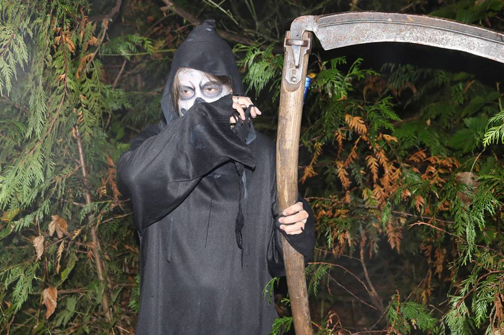 Don&rsquo;t fear the Reaper &mdash; he guides attendees along the dark path. Nicole Jennings/staff photo
