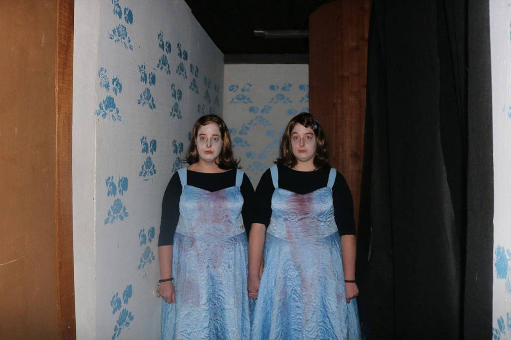 Many of the ghosts and ghouls come from popular horror movies and TV shows, such as these twins from &ldquo;The Shining.&rdquo; Nicole Jennings/staff photo