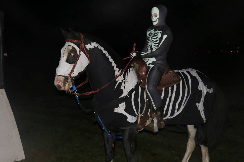 Ichabod Crane rides his skeletal horse (played by a real horse) through the woods of Beaver Lake. Nicole Jennings/staff photo