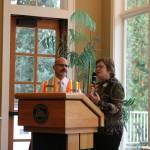 Sogge gives outgoing chamber board President Craig Doty, left, the President&rsquo;s Award for his time with the chamber. He wears a traffic safety vest to symbolize his volunteer work as a traffic director at the Sammamish Farmers Market. Nicole Jennings/staff photo