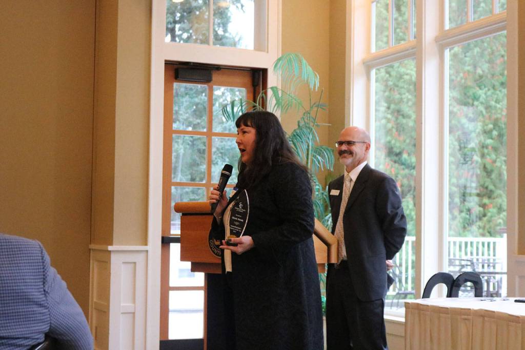 Glynis Matula receives the Sammamish Nights Volunteer Award from Doty. Nicole Jennings/staff photo