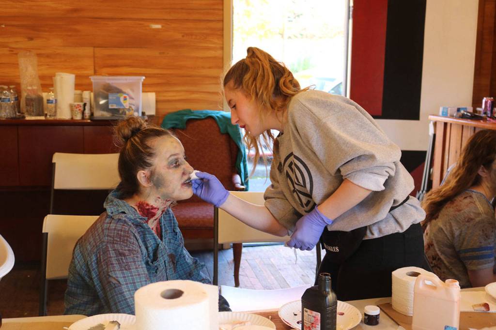 Volunteer makeup artists created the zombies&rsquo; ghoulish look. Nicole Jennings/staff photo