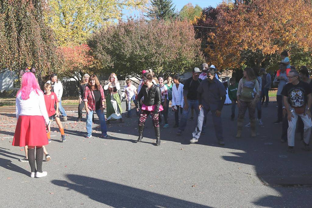 Before their march to City Hall, the zombies practiced the choreography for &ldquo;Time Warp&rdquo; and &ldquo;Thriller.&rdquo; Nicole Jennings/staff photo