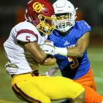 Photo courtesy of Rick Edelman/Rick Edelman Photography                                Eastside Catholic Crusaders safety Malik Putney, right, makes a tackle against the ODea Fighting Irish in a contest earlier this season.