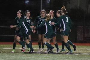 Photo courtesy of Don Borin/Stop Action Photography                                Skyline players surround senior Julia Mitchell following her goal against the Issaquah Eagles. The Spartans defeated the Eagles 1-0 on Nov. 2 at Gary Moore Stadium in Issaquah.