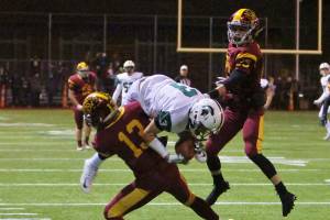 Photo courtesy of Jim Nicholson                                The Skyline Spartans defeated the Enumclaw Hornets 42-7 in a winner-to-state, loser-out playoff game on Nov. 3. Skyline will face the Bothell Cougars in first round of the Class 4A state playoffs on Nov. 10 or Nov. 11. Skyline wide receiver Luke Stiles (pictured) got hit hard by an Enumclaw defensive back after hauling in a pass down the sideline.