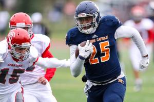 Photo courtesy of Rick Edelman/Rick Edelman Photography                                The Eastside Catholic Crusaders defeated the Stanwood Spartans 42-7 in a winner-to-state, loser-out football playoff game on Nov. 4 at Eastside Catholic School in Sammamish. Eastside Catholic (9-0) will face Edmonds-Woodway in the first round of the Class 3A state playoffs on Nov. 10 or Nov. 11. Eastside Catholic sophomore tight end DJ Rogers (pictured) makes a move up the field after hauling in a reception against Stanwood.